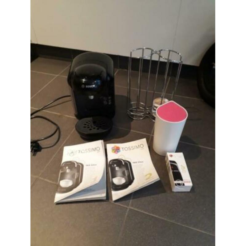 Tassimo met cupjes houder en boekjes.