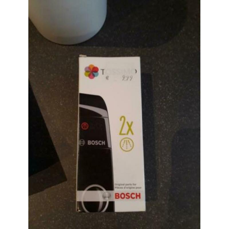 Tassimo met cupjes houder en boekjes.