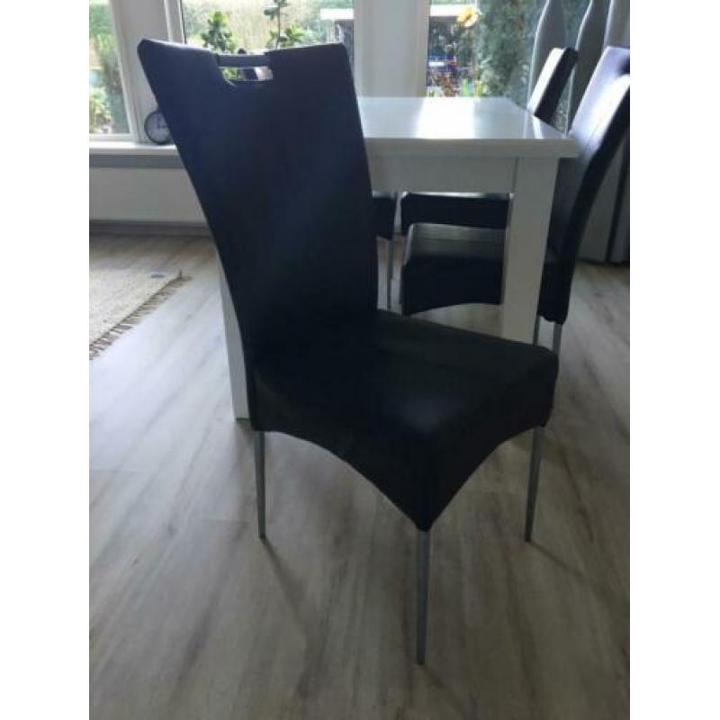Vier stoelen imitatie leer