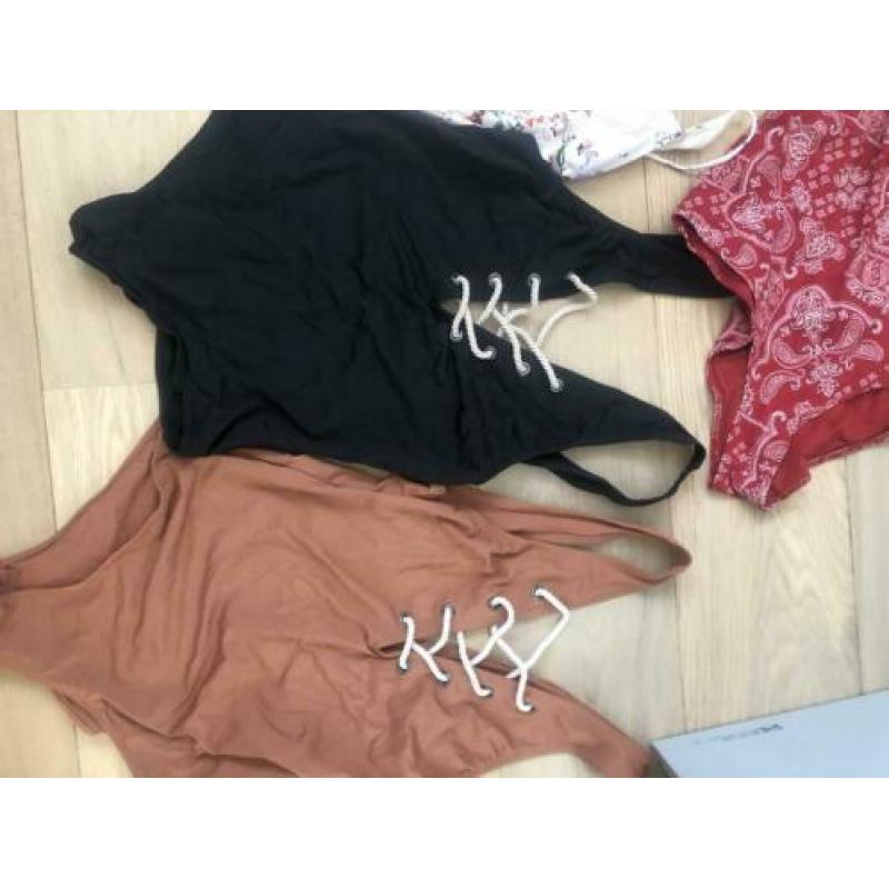 Badpakken 42 h&m trend zwart bloemen wit rood bruin halter