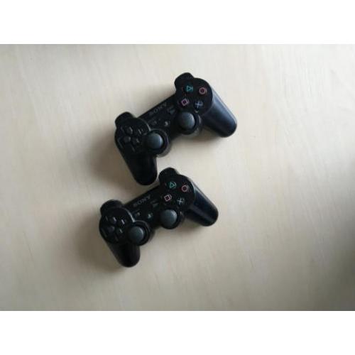 Playstation 3 + 2 controllers & spellen!